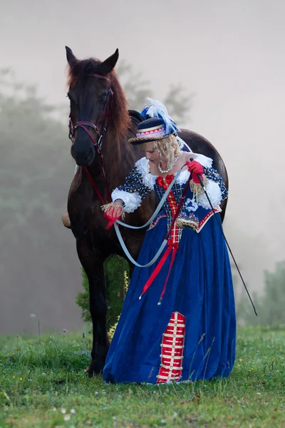 Woman in dress royal baroque riding — Stock Photo, Image