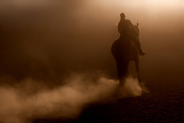 Horse riding in the dust