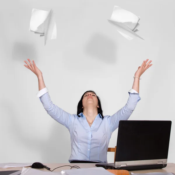 Woman throws out paper into the air — Stock Photo, Image