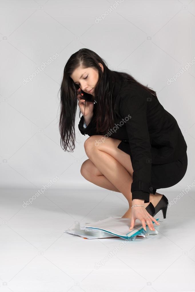 Young woman raised fallen documents