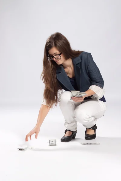 Young long-haired woman and money — Stock Photo, Image