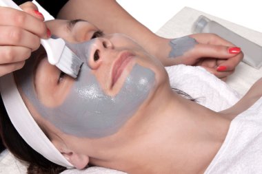 Applying cosmetic mask clipart