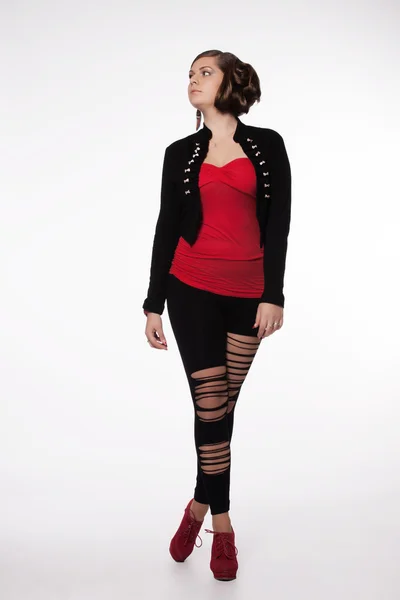 Young woman in red shirt, modern jacket, leggings with holes, re — Stock Photo, Image