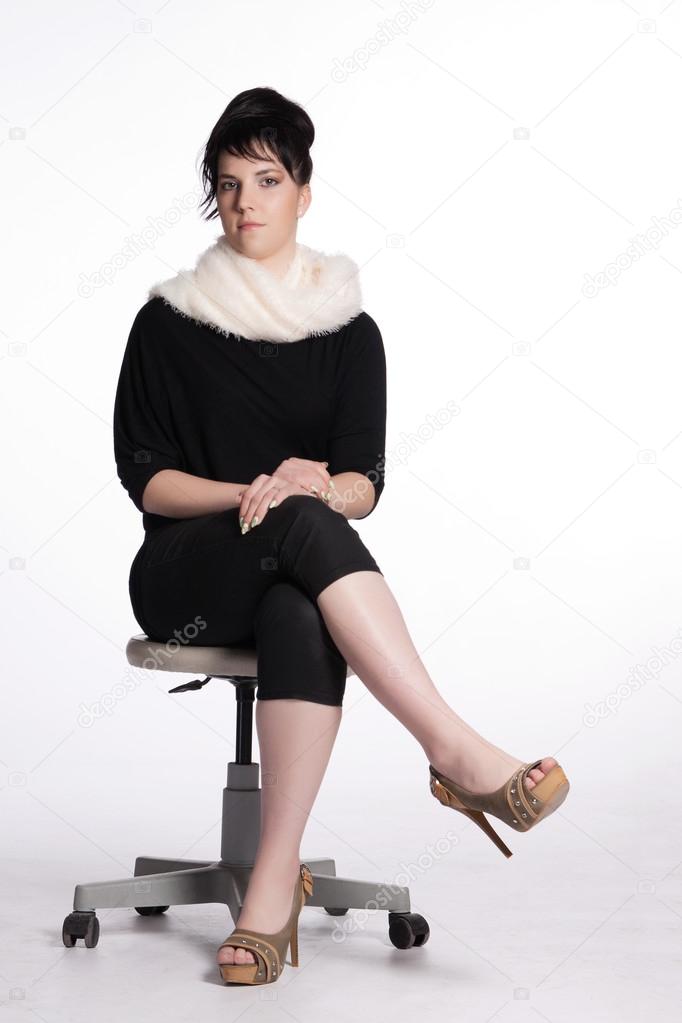 Young woman in black with white fur collar