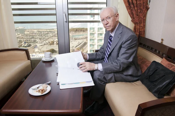 Senior Businessman Going Over Papers — Stock Photo, Image