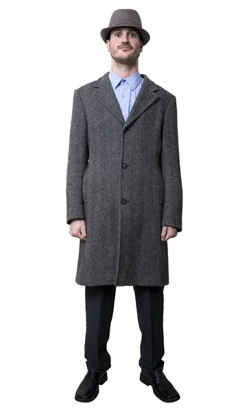 A young adult male wearing an overcoat and a matching hat — Stock Photo, Image