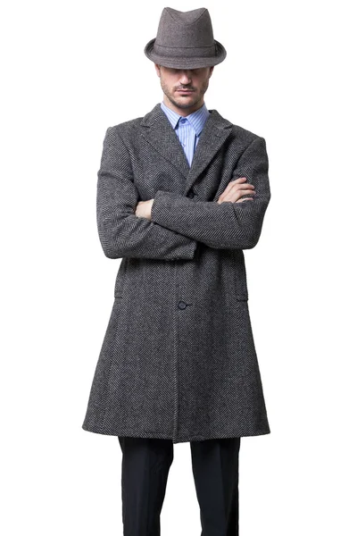 A person dressed in a gray overcoat and a gray hat — Stock Photo, Image