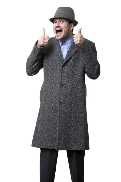 An adult male wearing an overcoat and a hat looking at the camera — Stock Photo, Image