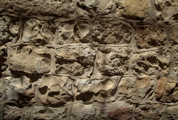 Parede de pedra texturizada áspera — Fotografia de Stock