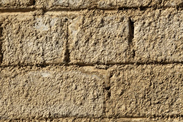 Ruige bakstenen muur - close-up — Stockfoto