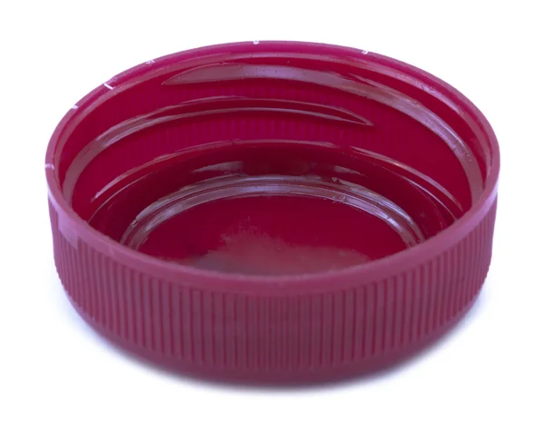 Rückansicht eines einzigen rosa-roten Plastikflaschenverschlusses — Stockfoto