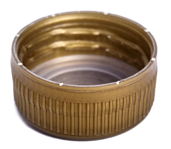 Geïsoleerde gouden plastic dop — Stockfoto