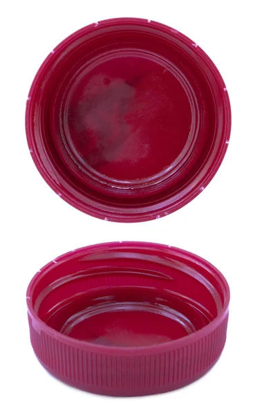 Two angles of the back side of a pink-red plastic bottle cap — Stock Photo, Image