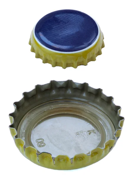 Geïsoleerde blauwe en gele metaal caps — Stockfoto