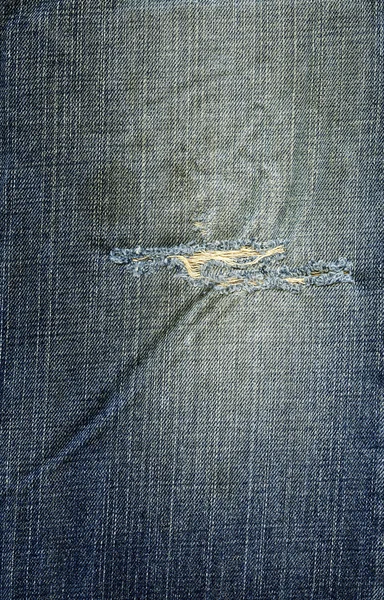 Denim tyg textur - rippade slitna blå — Stockfoto