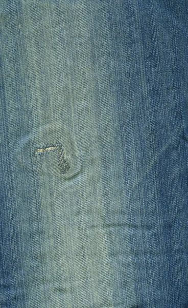 Jeansstoff Textur - abgewetzt blau genäht — Stockfoto