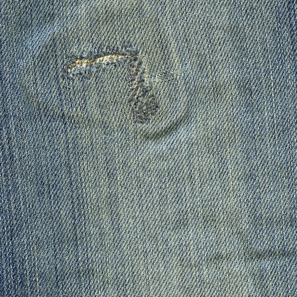 Jeansstoff Textur - abgewetzt blau genäht — Stockfoto