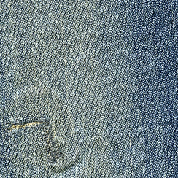 Jeansstoff Textur - abgewetzt blau genäht — Stockfoto