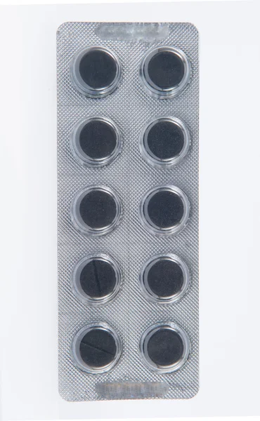Comprimé de charbon noir en plaquette thermoformée transparente — Photo