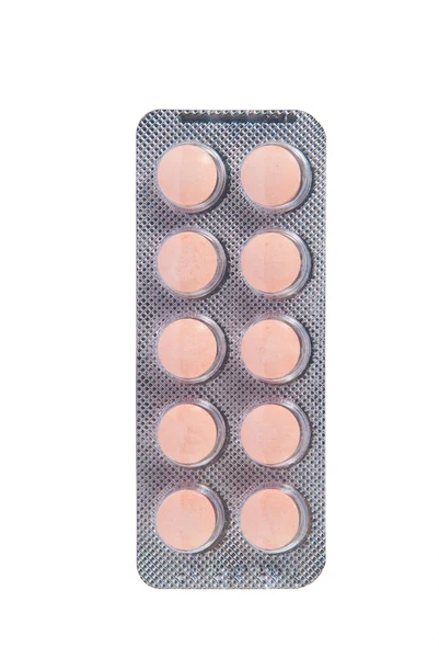 Pomarańczowy tabletki w przezroczyste opakowanie blister — Zdjęcie stockowe