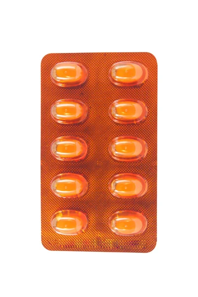 Yellow solf capsule in yellow blister pack — Stock Photo, Image