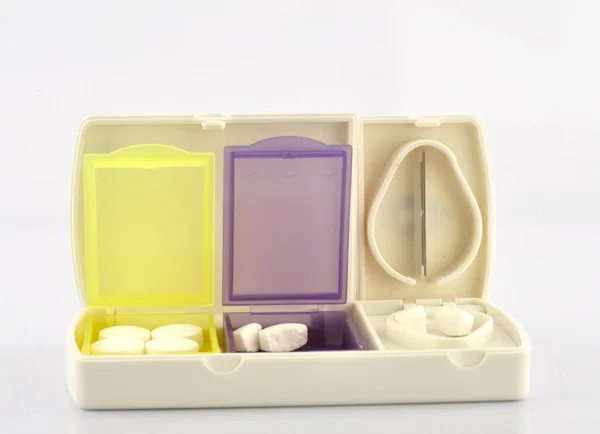 Caixa de pílula e lâmina dividida — Fotografia de Stock