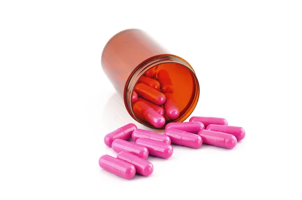 Roze capsule in voorschrift fles — Stockfoto