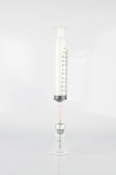 Medical ampoules and syringe — Stock Photo, Image