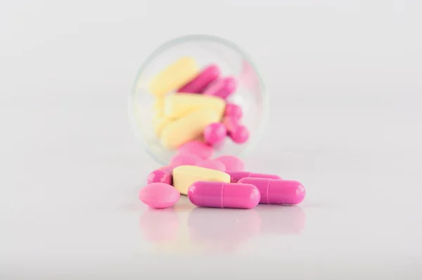 Medicine tablet in dosage glass — Stock Photo, Image