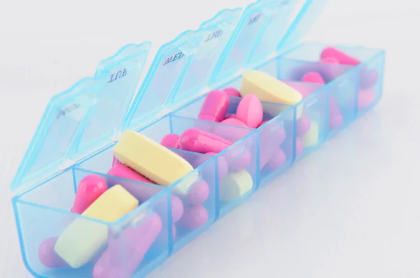 Capsule and tablet in daily pill box — Stock Photo, Image