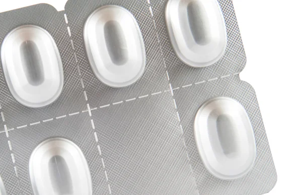 Closed up medicine tablet in aluminum blister pack — Stock Photo, Image