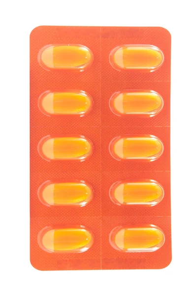 Tablet in yellow transparent blister pack — Stock Photo, Image