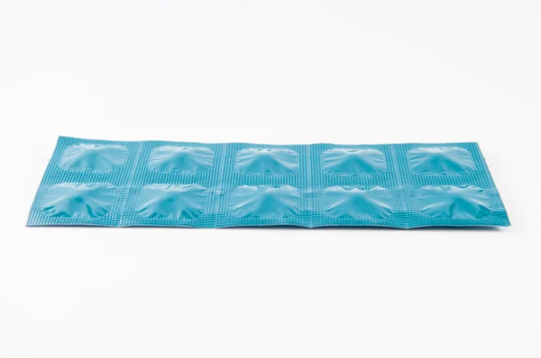 Closed up tablet in blue aluminum foil strip show medicine backg — Stock Photo, Image