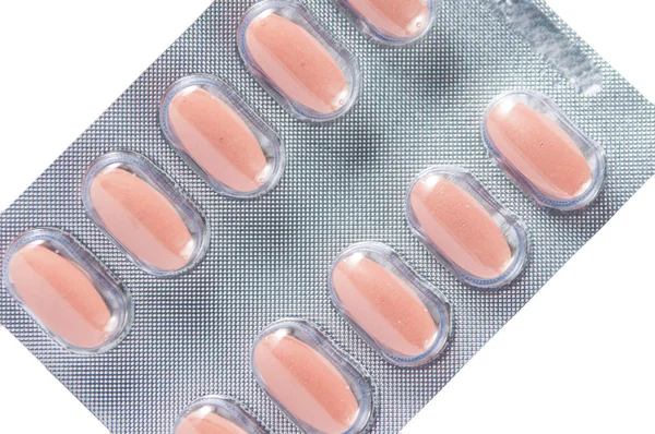 Verschlossene braune Tablette in transparenter Blisterverpackung — Stockfoto