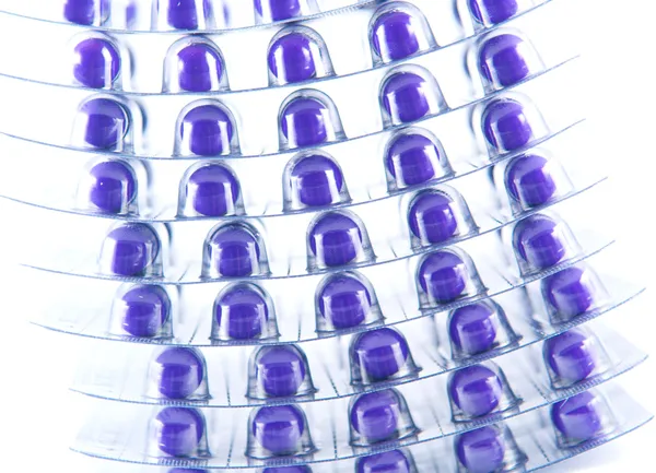 Layer of purple capsule in blister pack — Stock Photo, Image