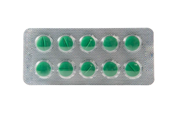 Gröna tabletten i transparent blisterförpackning — Stockfoto