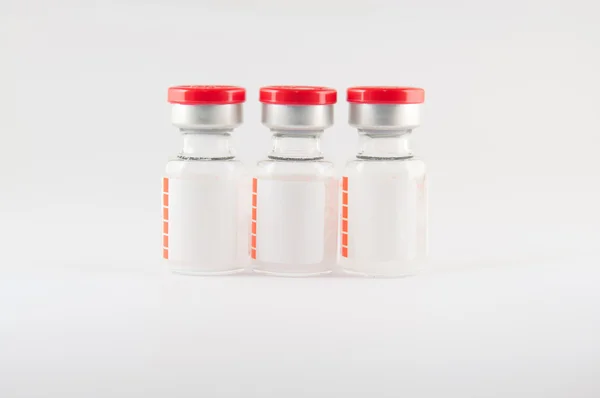 Red cap vial on white background — Stock Photo, Image