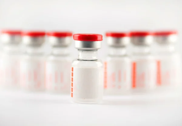 Row of injection vials — Stock Photo, Image