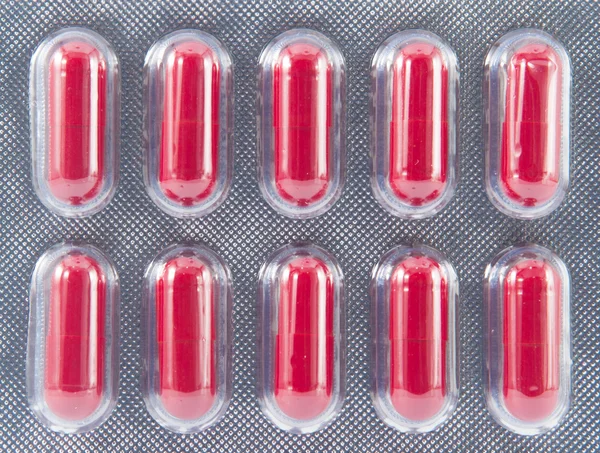 Kırmızı sert kapsül blister kutu içinde