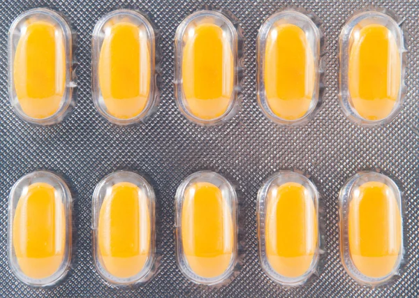 Blister pack of yellow tablet — Stock Photo, Image