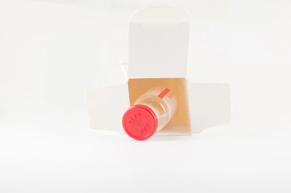 Red cap injection vial in container box — Zdjęcie stockowe