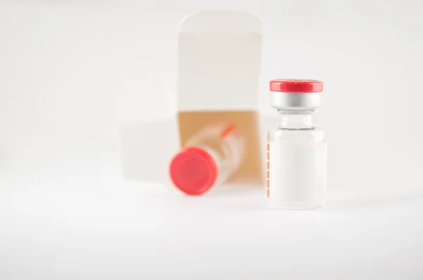 Red cap injection vial in container box — Stock Photo, Image