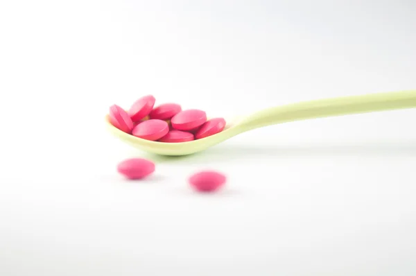 Spoon with medicine tablet — Stock Photo, Image
