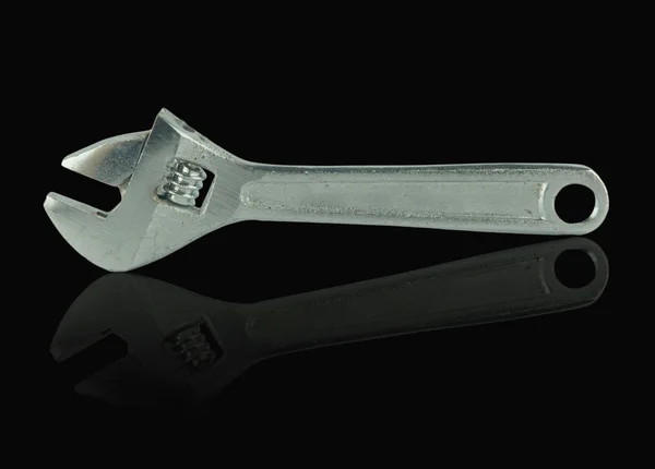 Closed up Adjustable Wrench isolated on black background — Stock Photo, Image