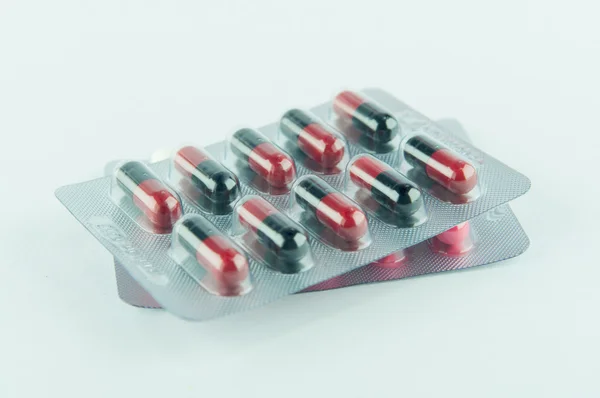 Medicine blister pack of red and black capsule — Stock Photo, Image