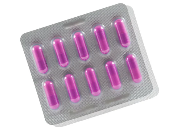 Paarse lange capsule in transparante blister pack — Stockfoto