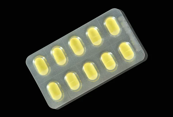 Comprimido amarillo en blíster — Foto de Stock