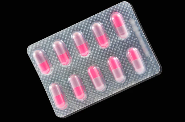 Medicine capsule in transparent blister pack — Stock Photo, Image