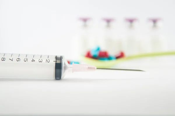 Disposable Syringe and medicine background — Stock Photo, Image