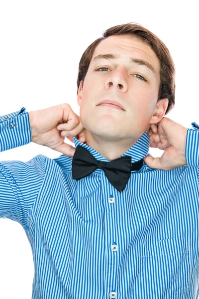 Handsome gentleman adjusting his bow tie — Stock Photo, Image